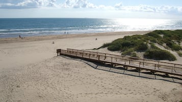 On the beach, sun loungers, beach towels