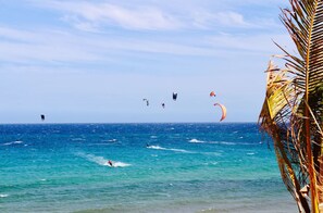 On the beach, sun-loungers, beach towels