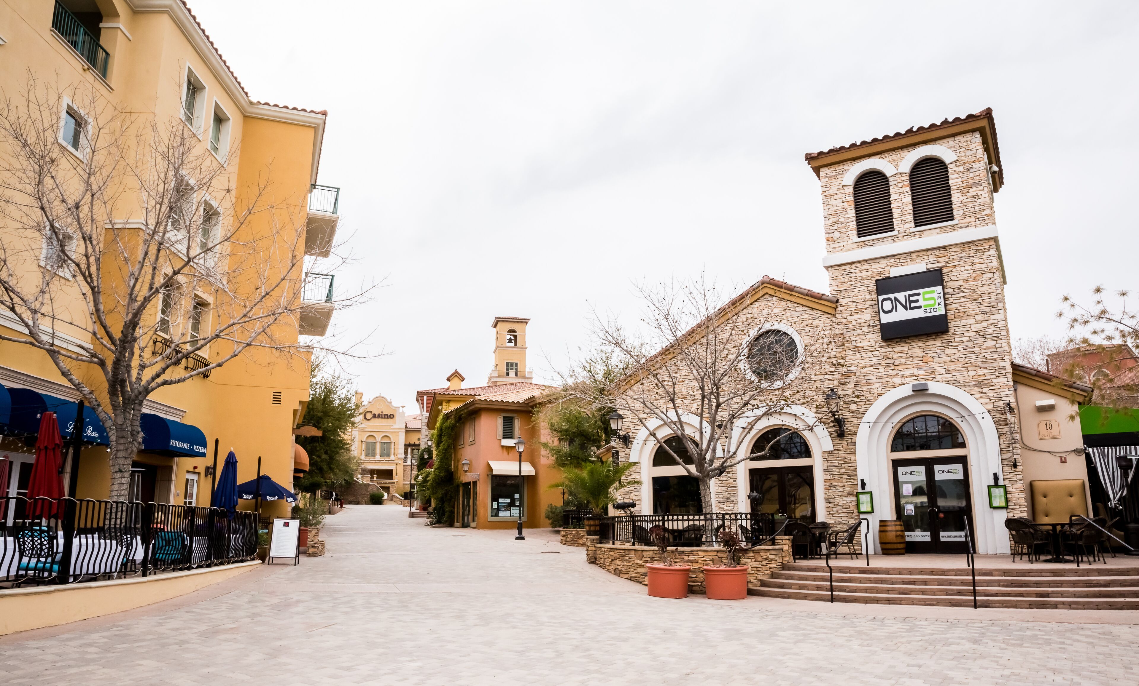 A street with buildings, including a casino and a restaurant.