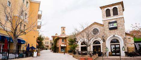 A street with buildings, including a casino and a restaurant.