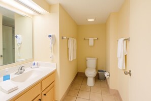 A small bathroom with a sink, mirror, toilet, and towel rack. - Gorgeous Direct Oceanfront 2-BR Condo In The 2nd Floor in Broadwalk, Downtown MB (Myrtle Beach)