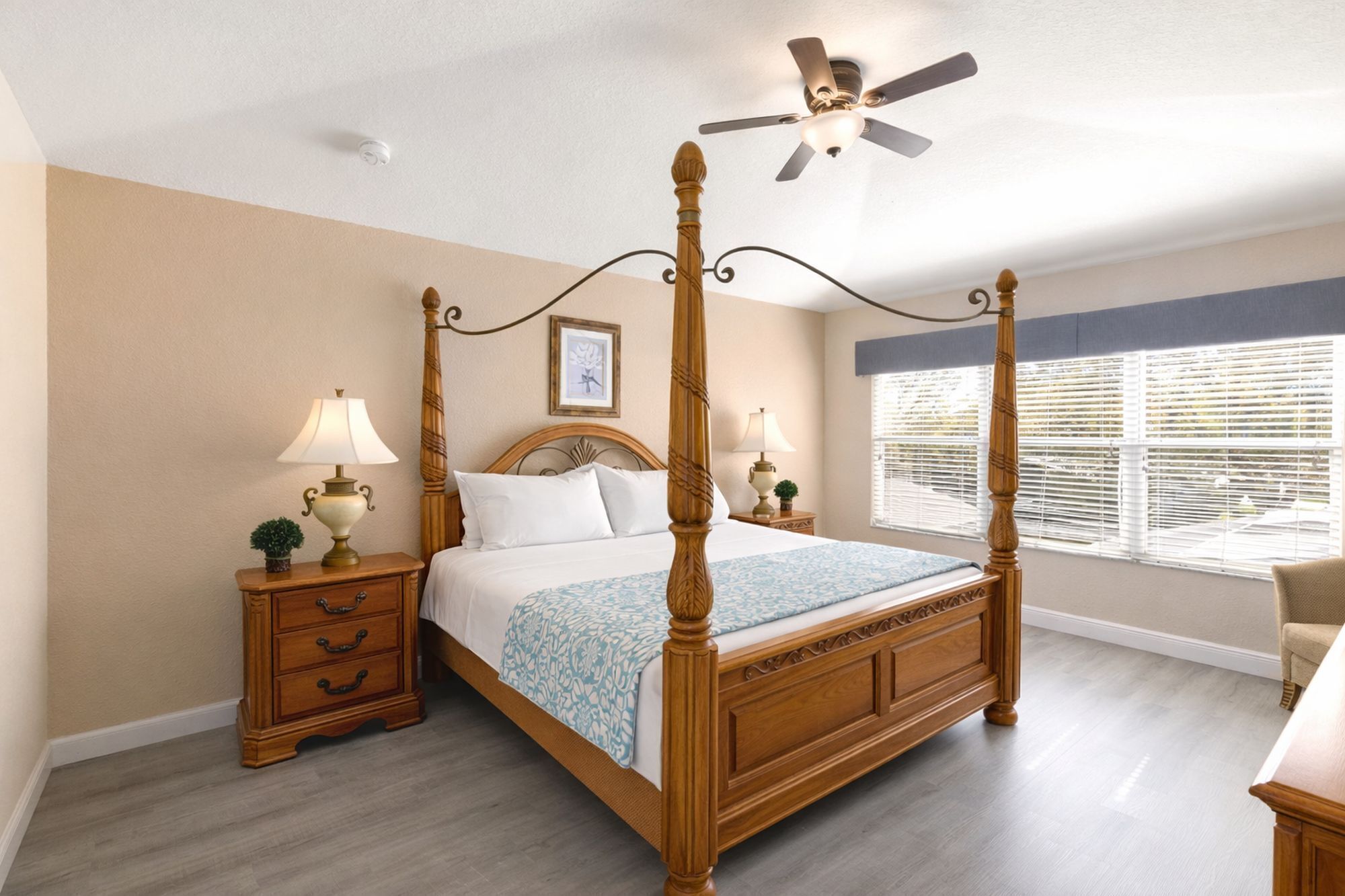 2nd floor primary king bedroom with a 40" HD LED TV and ceiling fan
