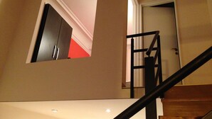 A staircase with a metal railing leading to a landing. - Superb Central Location! SPECIAL OFFER (Montserrat)