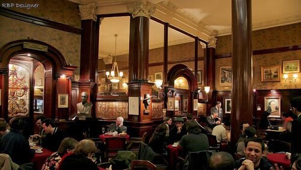 A crowded restaurant with wooden decor and chandeliers. - Superb Central Location! SPECIAL OFFER (Montserrat)