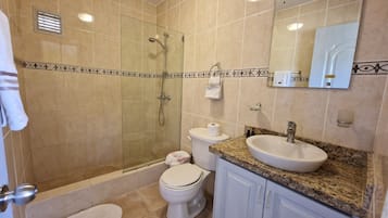 Shower, hair dryer, towels, soap