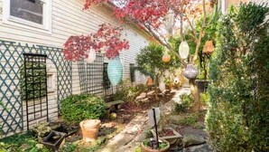 A garden with a variety of plants and a small pond. - BEST LOCATION: Historic Shepherdstown Getaway (Shepherdstown)