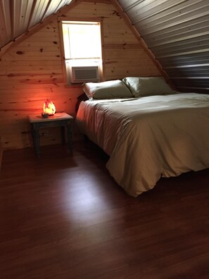 Desk, iron/ironing board, bed sheets