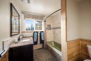 Combined shower/tub, hair dryer, towels, soap