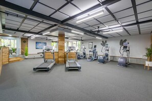 A gym with treadmills, elliptical machines, and stationary bikes. - North Coast A101 Corner condo West & South Facing Ocean views from Two Balconies (Oceanside)