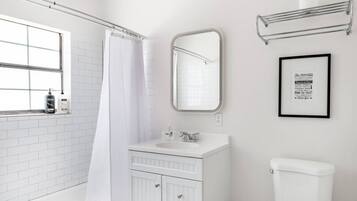 Combined shower/tub, hair dryer, towels, soap