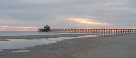 Stroll along the pier, taking in the serene views of the ocean.