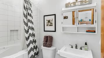 Bathtub, hair dryer, towels, soap