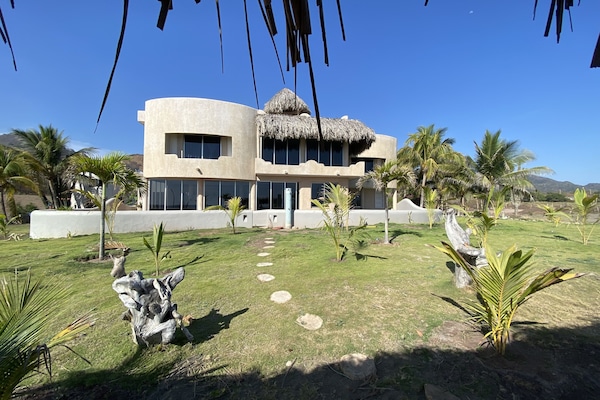 Castillo de Arena from the private beach front palapa and hammocks.