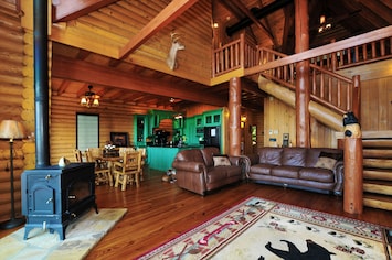 Large open real-- Log Cabin. Feature large 75" TV with SONOS sound system.