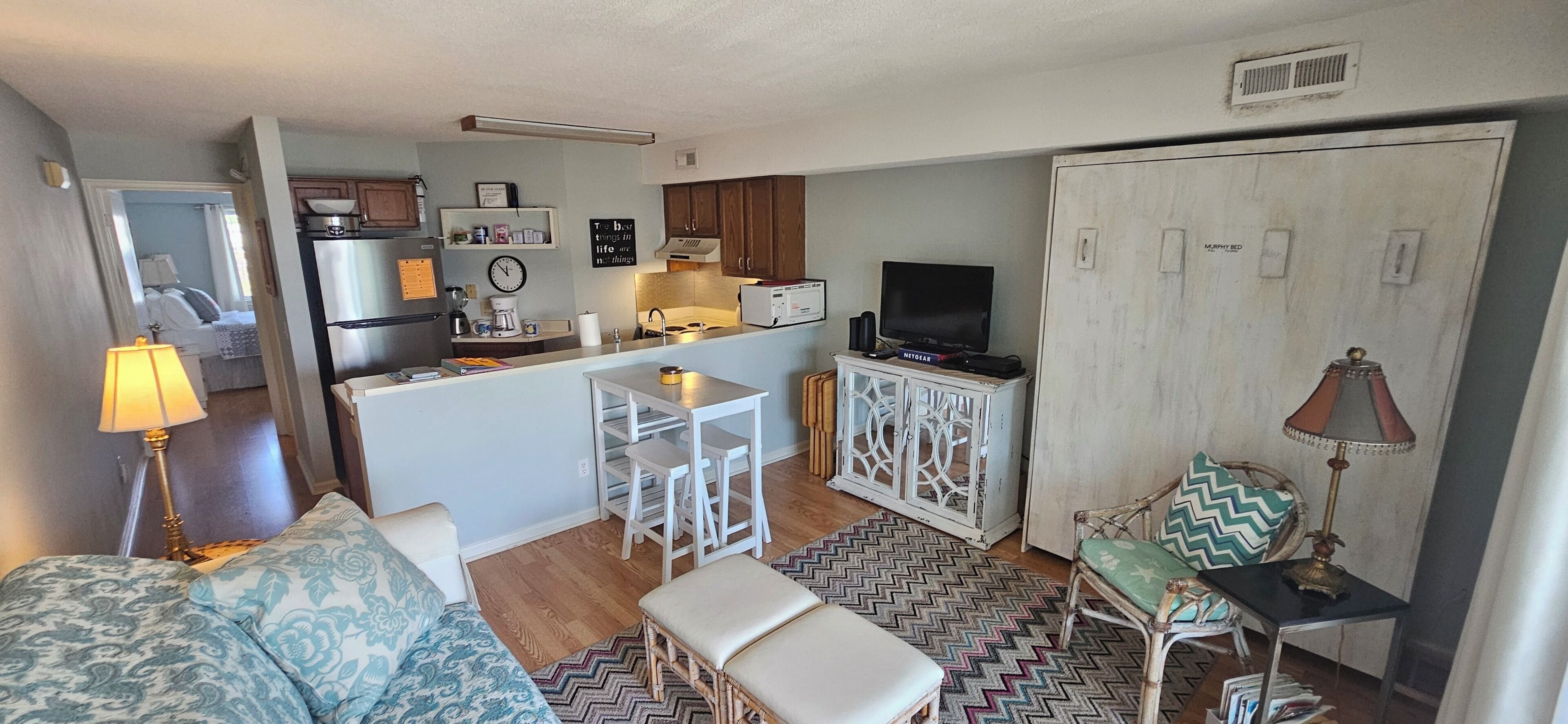 Flat-screen TV, DVD player, books