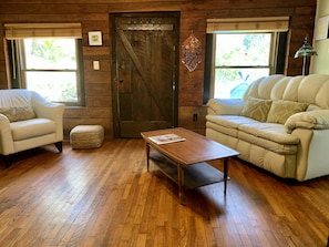 Cushy ,reclining Loveseat and comfy leather chair....lots of natural light