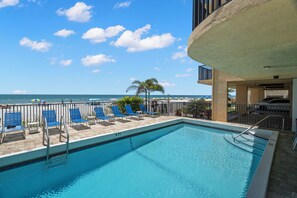 A swimming pool with a view of the beach and ocean. - Special Rates for Nov 21 - Dec 19, 2026 - All Rooms Directly Beach Front (Madeira Beach)