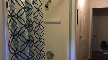 Combined shower/tub, hair dryer, towels, toilet paper