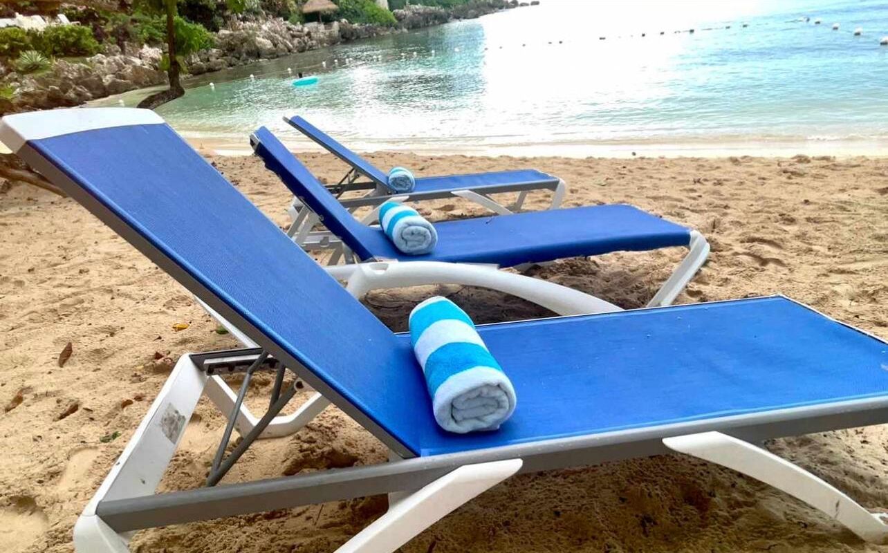 On the beach, sun loungers, beach towels