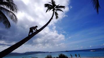 On the beach, white sand, beach towels