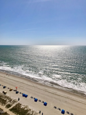 On the beach, sun loungers, beach towels