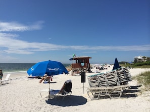 A beach with lounge chairs, umbrellas, and a lifeguard tower. -  Lido Beach Gulf View Condo w/ pool. Right across from beach! !
OFF SEASON RATES (Sarasota)