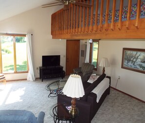 Smart TV, fireplace, books, stereo