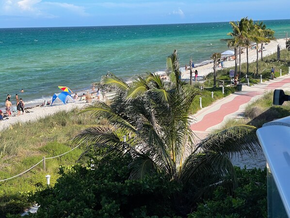 On the beach, sun loungers, beach umbrellas, beach towels