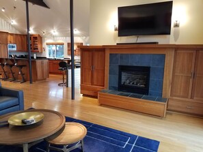 Cozy up in the front of the gas fireplace or watch tv on the big screen