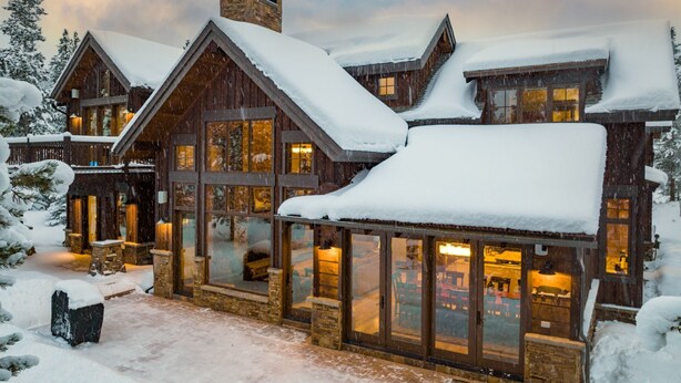 A large wooden lodge with multiple windows and a snow-covered roof. - Last Nickel Lodge: Private Home on Golf Course, Hot Tub, Pool Table, Foosball (Breckenridge)