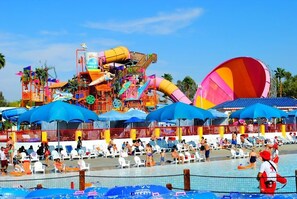 A water park with various water slides and a pool area with lounge chairs. - Cozy House to  Disney/Knott's/Hollywood /San Diego/Universal Studio/Beaches (Anaheim)