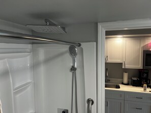Combined shower/bathtub, hair dryer, towels, soap