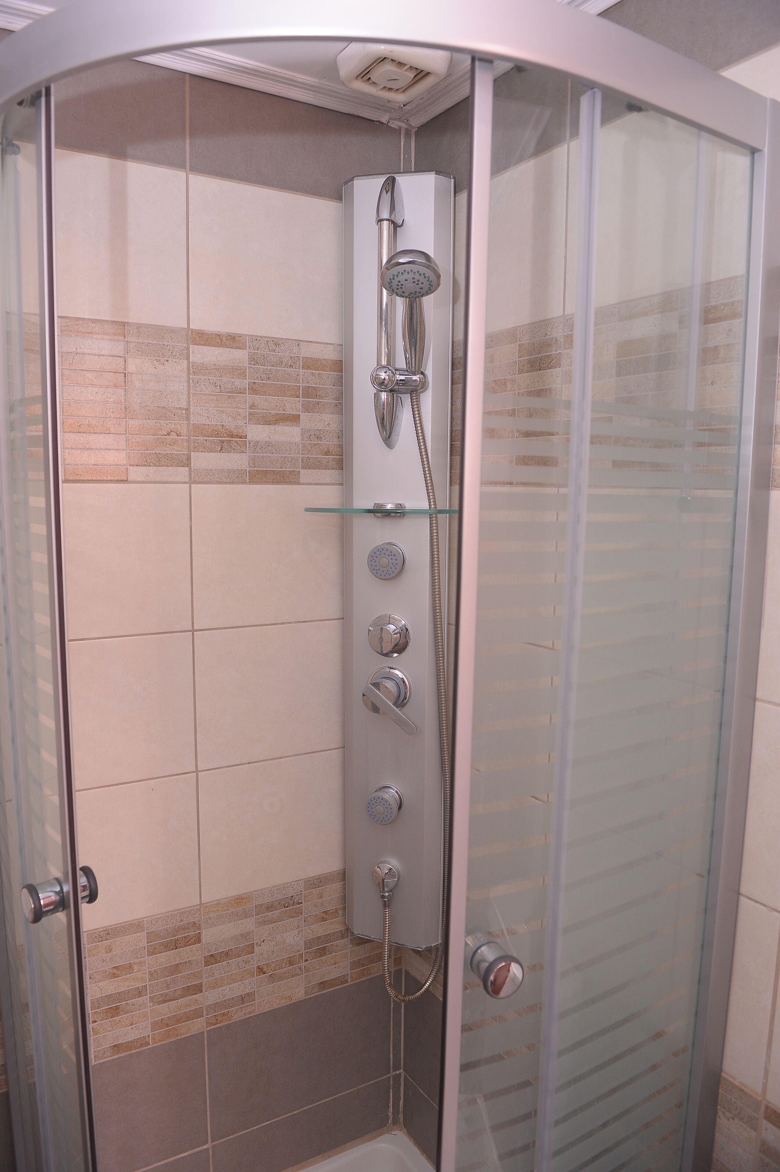 Shower, hair dryer, towels, toilet paper