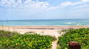 Private beach, white sand, sun loungers, beach umbrellas