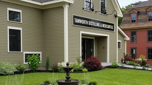 A building with a sign reading "Tamworth Distilling & Mercantile."