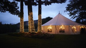 A tent with multiple windows and a white exterior.