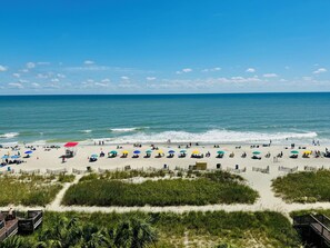 On the beach, sun-loungers