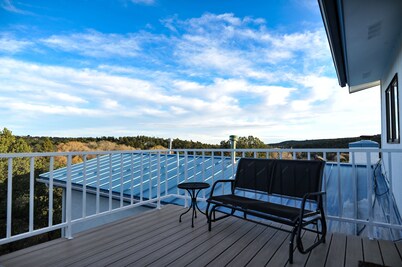 One Cozy BR and a separate Large BR that opens onto a Deck with Mountain views