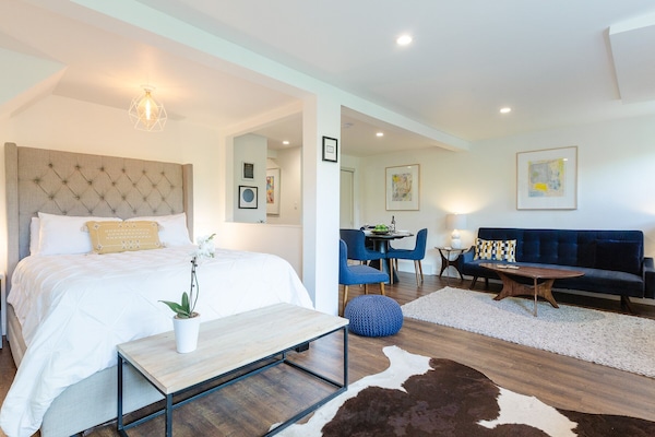 Plush queen size bed and bright and airy room.