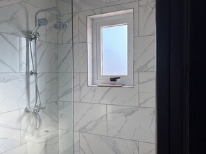 Shower, hair dryer, towels, soap