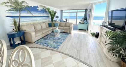 Preciosa unidad frente al mar, ideal para familias, con un balcón privado de 1000 pies cuadrados