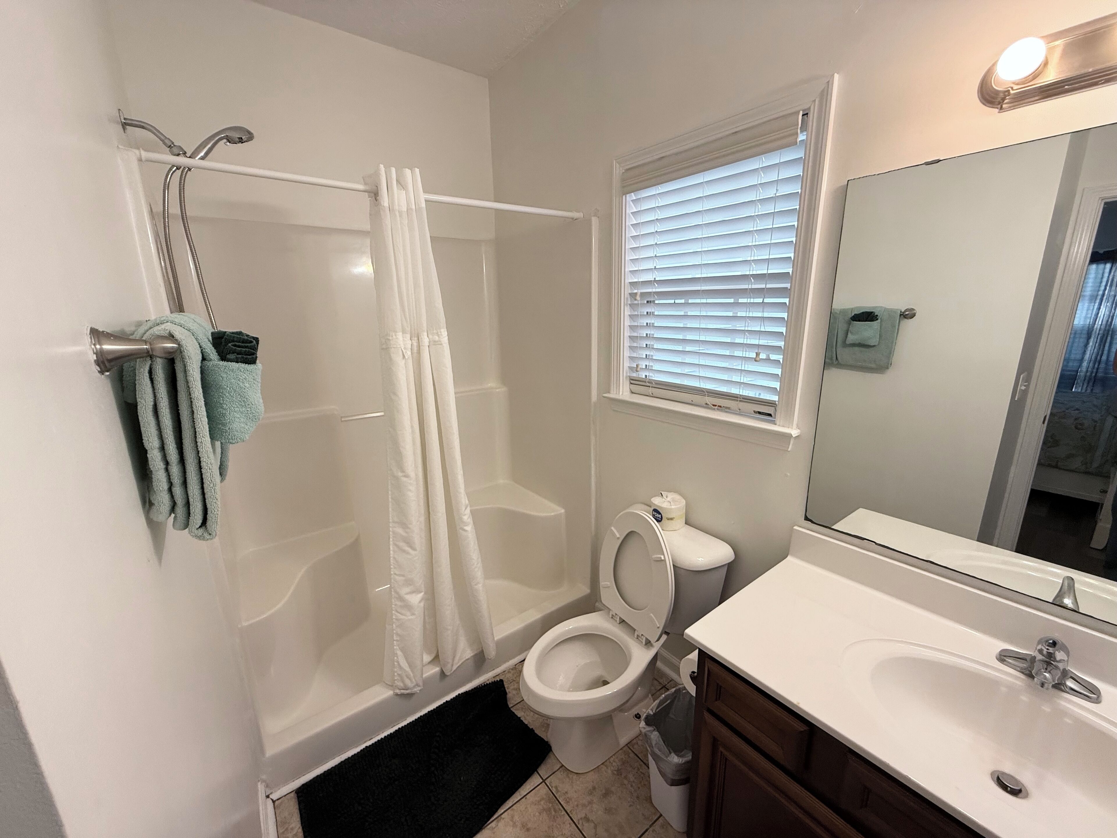 Combined shower/tub, hair dryer, towels, soap