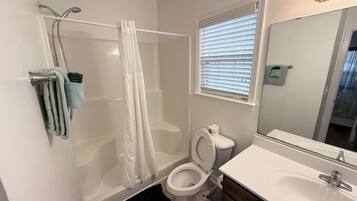 Combined shower/tub, hair dryer, towels, soap