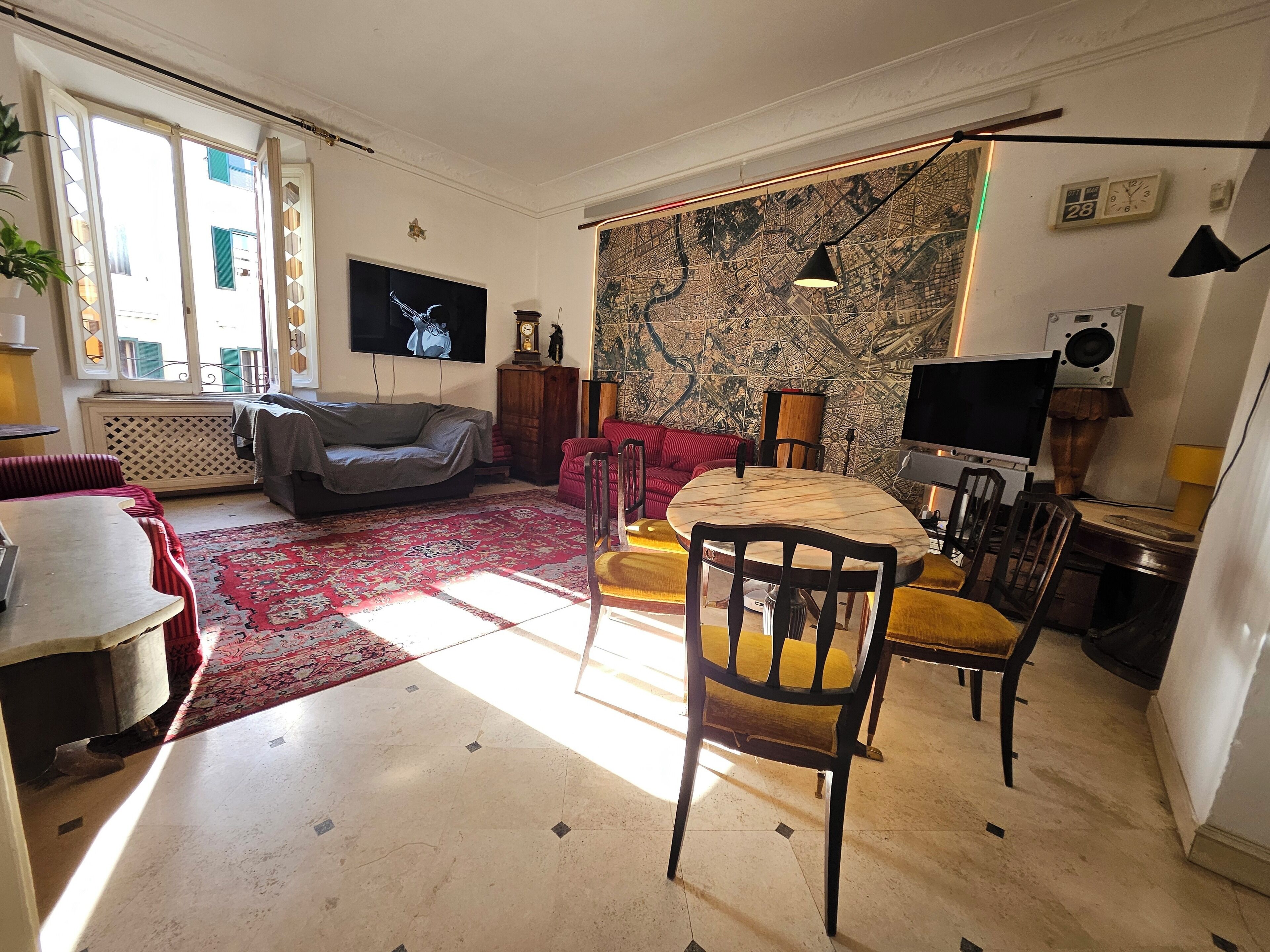 Flat-screen TV, video library, stereo