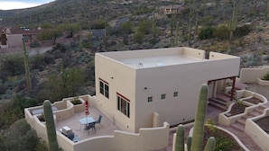 A modern house with a patio, surrounded by cacti and desert vegetation. - Amazing City And Mountain Views From The Foothills Of The Catalinas (Tucson)