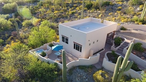 A modern house with a flat roof, a patio with a hot tub, and a staircase leading to the entrance. - Amazing City And Mountain Views From The Foothills Of The Catalinas (Tucson)
