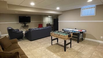 Smart TV, fireplace, video-game console, foosball
