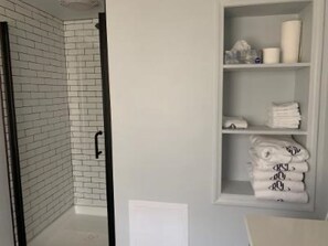Combined shower/tub, hair dryer, towels, soap