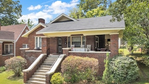 A two-story brick house with a covered porch, a front staircase, and a well-maintained lawn. - Fabulous Location Updated 3bd/2bth Home (Birmingham)