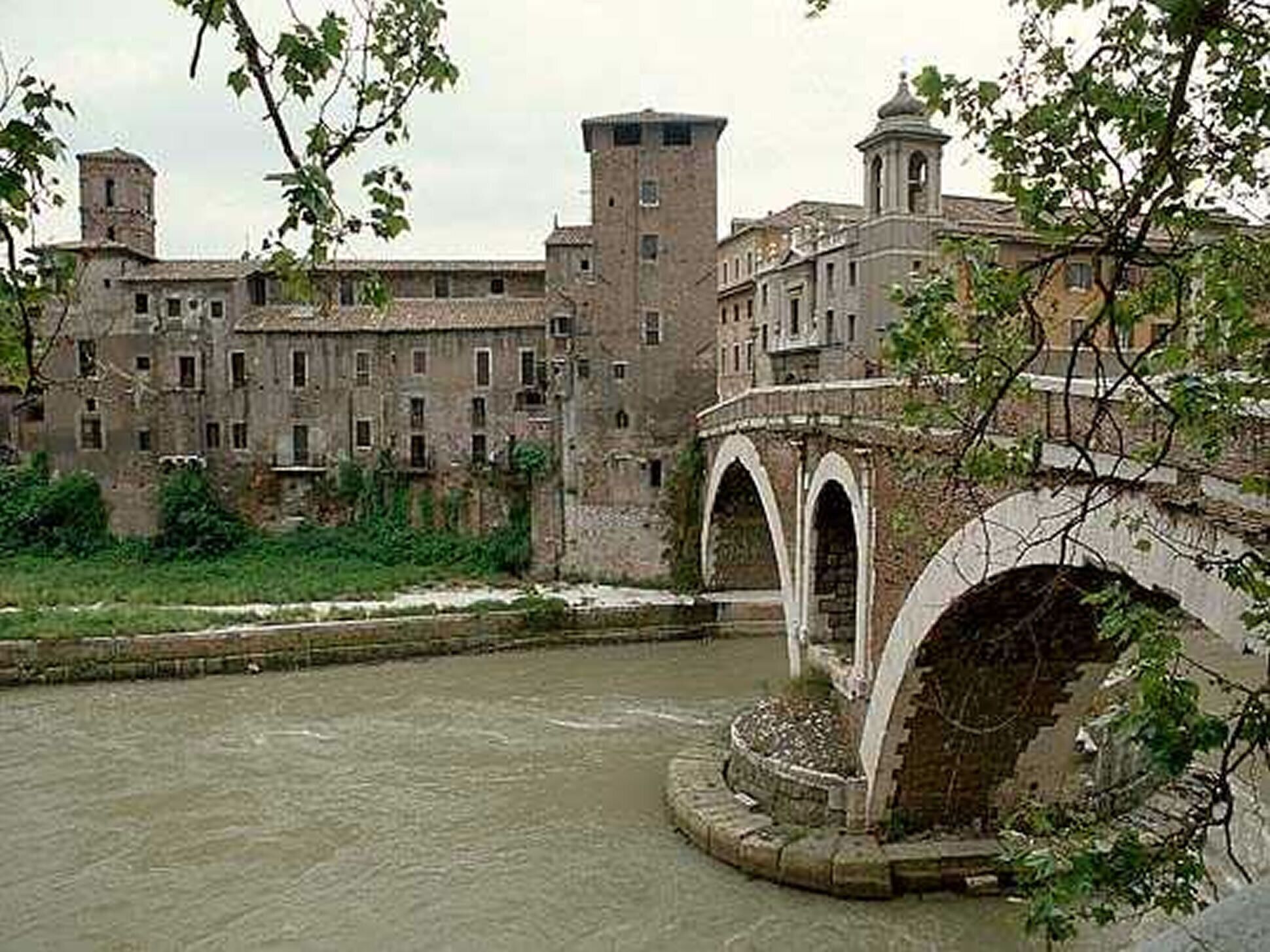 A historic building with multiple towers and a central courtyard.